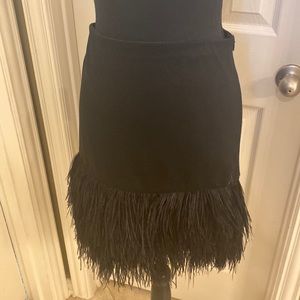 Black skirt with ostrich feathers.